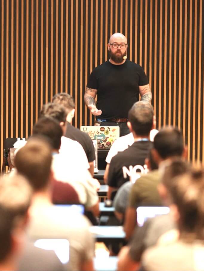 Jason Lengstorf, the author of EnterpriseJamstack.com, photographed while teaching a workshop